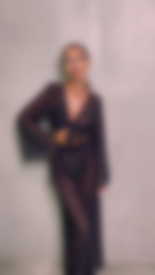 Introducing the unique Jannet set— the embodiment of elegance and lightness. This women's suit, made from Italian Carvico mesh, consists of wide, loose-fitting pants and a top with wide, flowing sleeves, making it perfect for creating a sophisticated look for beach parties and outings.